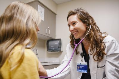 Pediatrician, Dr. Hilden with patient