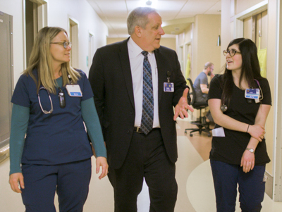 CEO with employees on unit