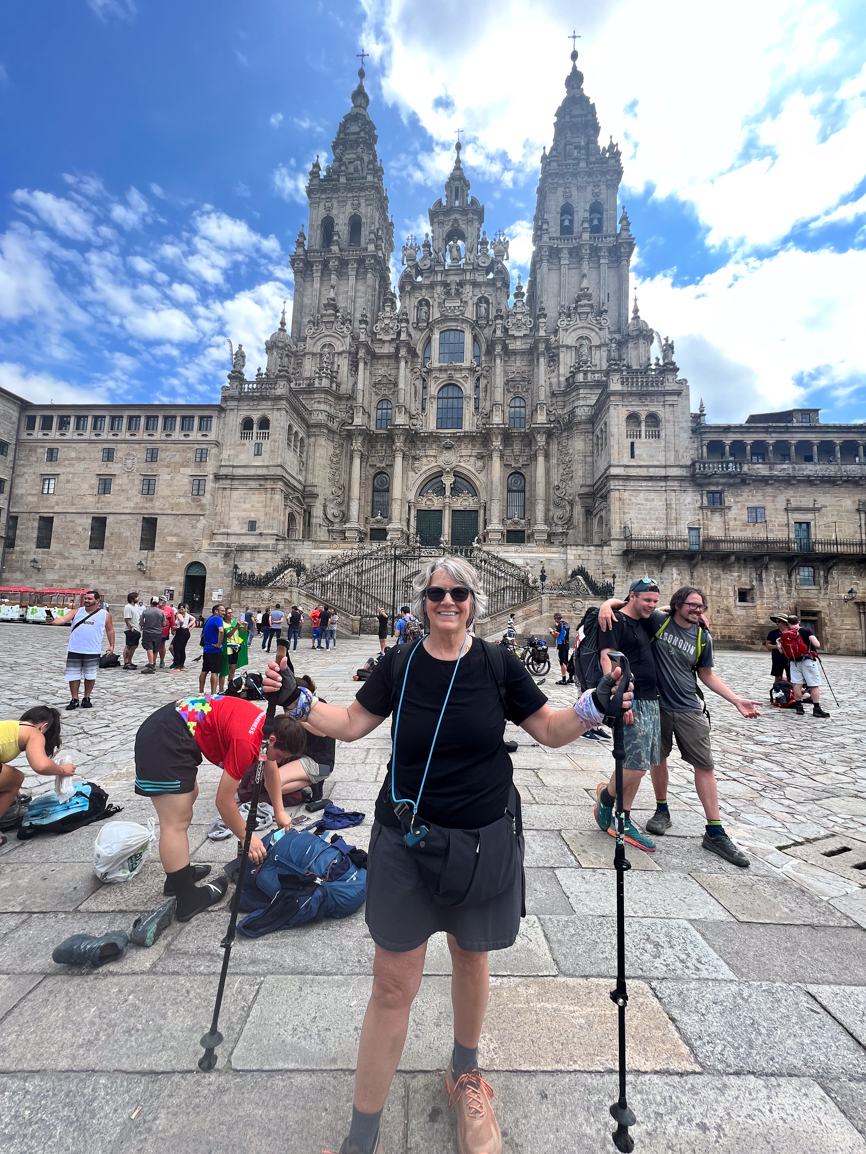 woman in front of cathedral landmark in Spain