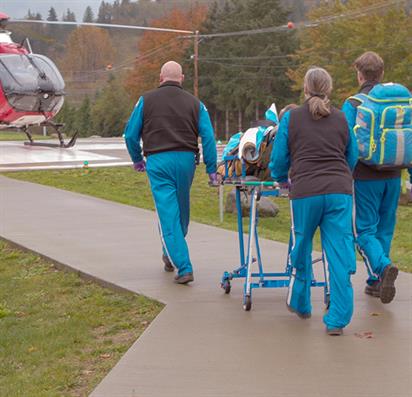 Airlift team walking to helicopter