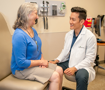 Dr. Sheu with patient