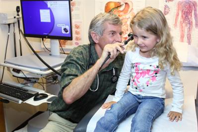 Provider looking in child's ear