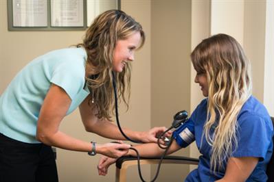 Provider taking blood pressure